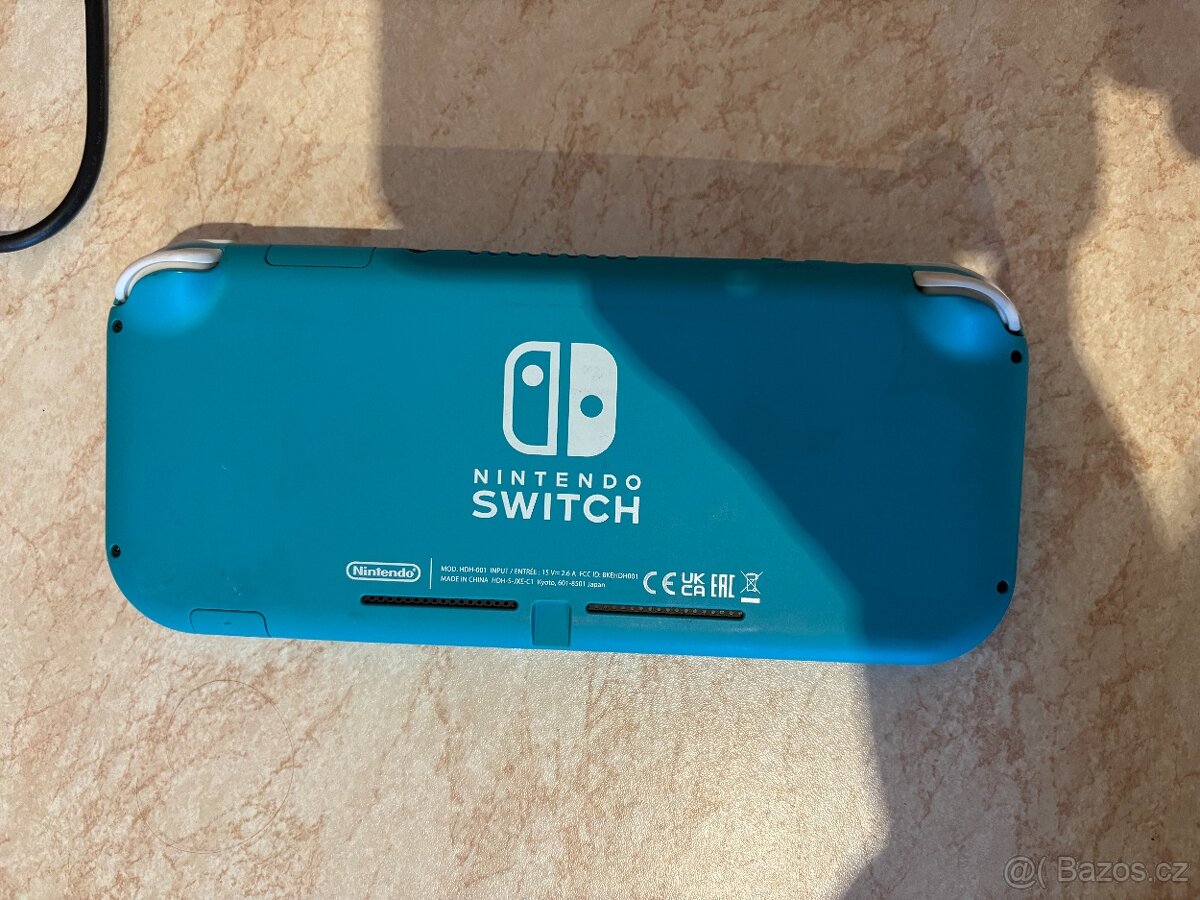 Nintendo Switch Lite Turquoise (světle tyrkysová) + 4 hry - 4