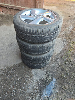 Prodám sadu Alu disků Mazda 7Jx16H2 ET55 + pneu 205/55/16 - 4