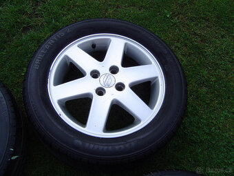 4X LETNÍ HLINÍKOVÁ KOLA SUZUKI SWIFT 185/60 R15 - 4