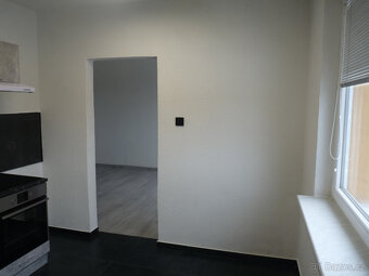 Pronájem kompletně zrekonstruovaného bytu 2+1 Spartakiádní 1 - 4