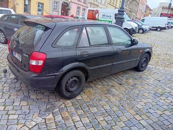 Mazda 323 f - 4