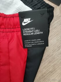 Nové šusťákové kalhoty s podšívkou Nike vel. L - 4