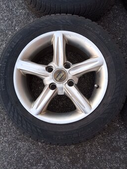 Sada zimních alu kol na Ford - 185x60R-14. - 4