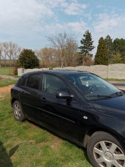 Mazda 3 sedan - 4