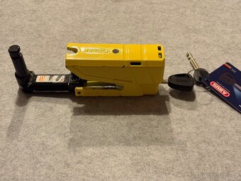 Zámek na brzdový kotouč, s řetězem. Abus - 4