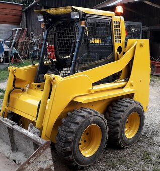 smykový nakladač  KOMATSU SK 09 - 4