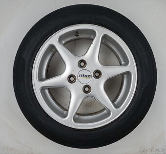 Ford Focus - 15" alu kola - Letní pneu - 4