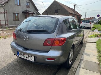 Mazda 3 1,4 - 4