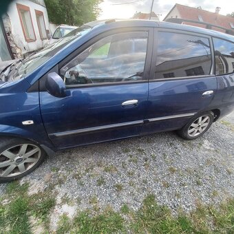 Kia carens - 4