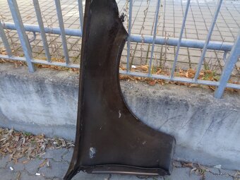 BMW 1 E87 blatník levý 41357133227 - 4