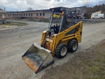 SMYKOVÝ NAKLADAČ TCM/BOBCAT 604 - 4