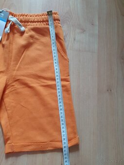 Nové teplákové oranžové kraťasy bermudy sinsay v.128 - 4