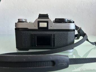 Canon AE-1 + Canon FD 50mm f/1.8 - 4