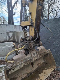 Kolový bagr Caterpillar M315 - 4