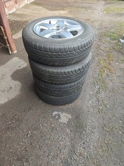 Prodám sadu ALU disků PEUGEOT + letní pneu 185/65/R15 - 4