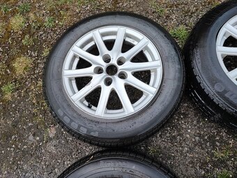 Prodám ALU kola rozteč 5x100 R15 ET 35 s letním pneu 195/65 - 4