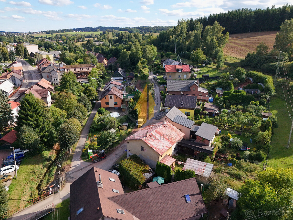 Prodej rodinného domu se zahradou o celkové ploše 216 m² v o - 5