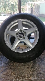 Celoroční pneu s disky 5x112 .215/65 r16 - 5