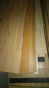 Prodám laminátovou podlahu, přechodové a obvodové lišty - 5