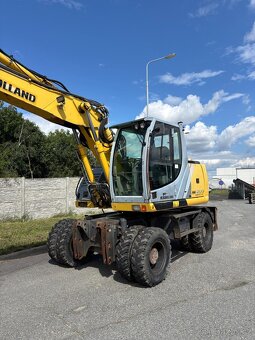 Kolové rypadlo / nakladač New Holland MH CITY - 5