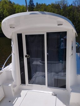 Aqualine 645 + Mercury F 150 L EFI a lodním vlekem Tema Boat - 5