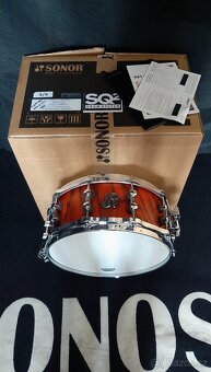 Prodám nový snare Sonor SQ2 Birch- 14x6" Fiery red - 5