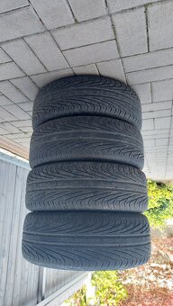 Alu disky Ford (Ronal) 5,5Jx14H2 s pneu Uniroyal - 5