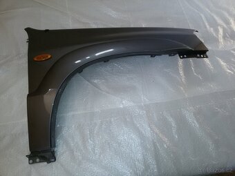 Mazda Tribute: Blatník pravý - 5