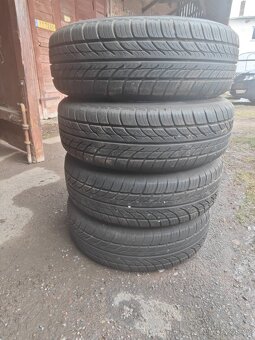 Prodám sadu ALU disků PEUGEOT + letní pneu 185/65/R15 - 5