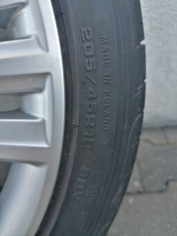 Prodám sadu letních kol R18 5x100 originál škoda Scala - 5