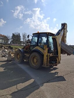 Rýpadlo - nakladač CAT 444F - 5