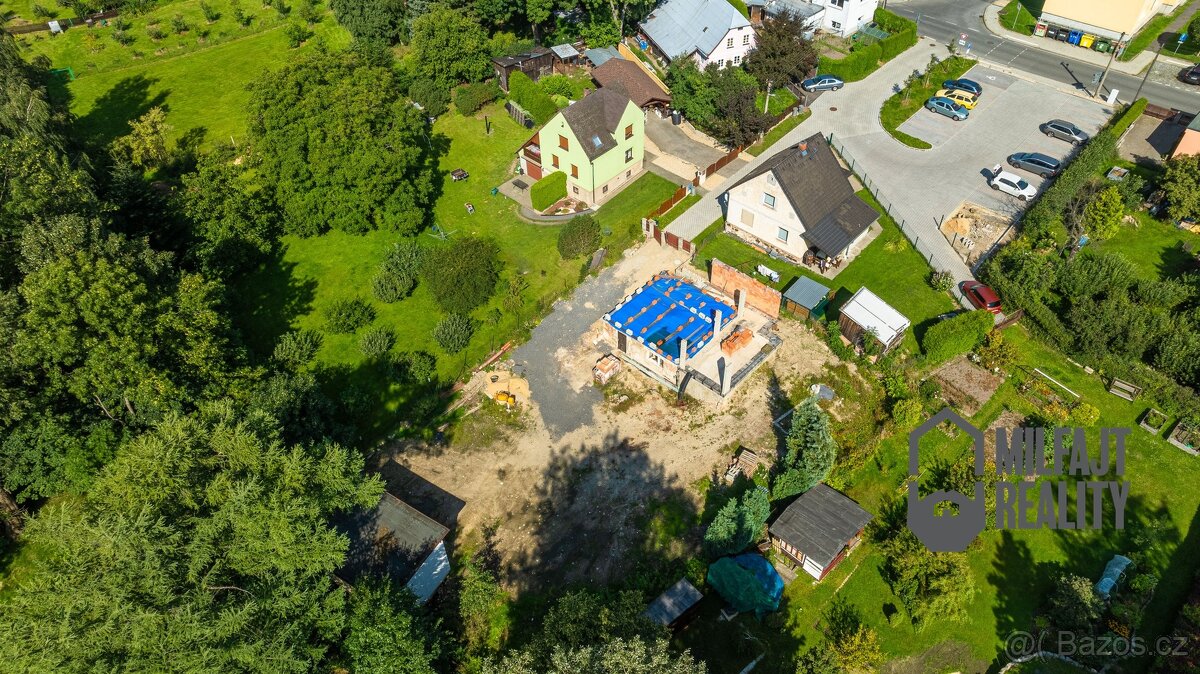 Prodej stavebního pozemku s projektem na RD 1 036 m², Nové M - 6