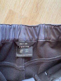 Zateplené šusťáky vel. 134, softshellové kalhoty vel. 152 - 6