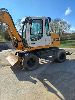 Kolovy bagr rypadlo liebherr 309 - 6