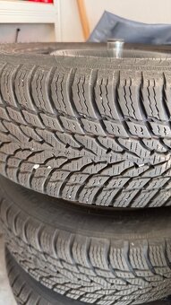 Nokian snowproof 185/60/15 s plechy na Fabia III - 6