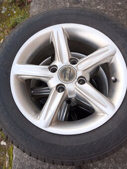 Sada zimních alu kol na Ford - 185x60R-14. - 6