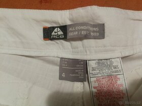 Bílé dámské kalhoty Nike - velikost 38 - 6
