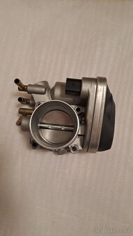 Škrtící klapka VAG 06A133062A - 6