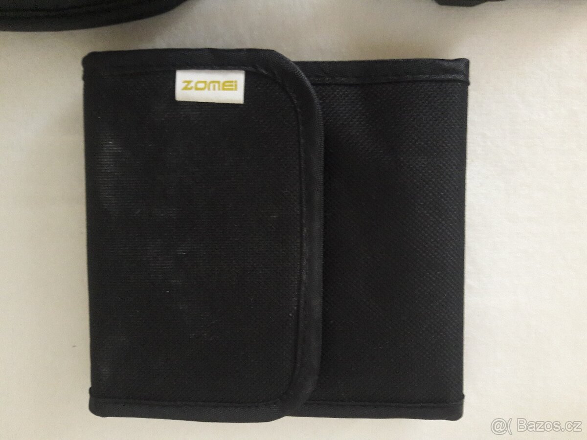 Krytka objektivu, popruh, clona, difuzer, očnice.. - 7