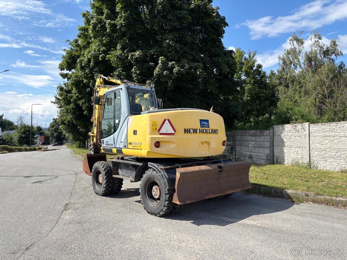 Kolové rypadlo / nakladač New Holland MH CITY - 7