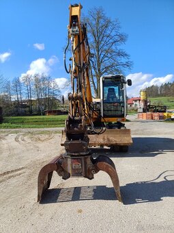 Kolovy bagr rypadlo liebherr 309 - 7