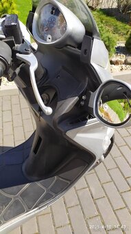 Kymco Grand Dink 125 - 7