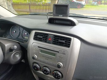 Prodám Suzuki Liana 1,6i , 4x4 , dovoz - 7