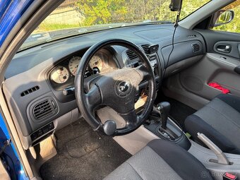 Mazda 323f bj - 7