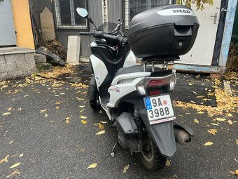 Yamaha Tricity 125 (Loupež v obchodě Hublot) - 7