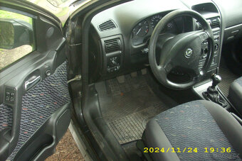 Opel astra caravan 1.8 - 7