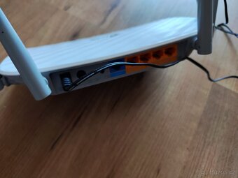 Wifi routery HONOR 3 Wi-Fi 6 Plus a TP-Link Archer C50 - 7