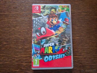 NINTENDO SWITCH OLED (bílá verze) + 4 HRY A CESTOVNÍ OBAL - 8