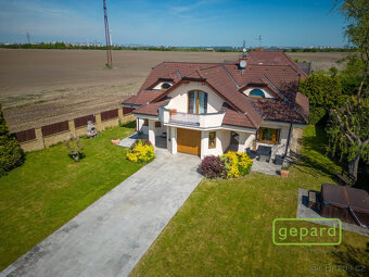 Praha 10 - Dubeč, Samostatná vila, 5+1/T/G s pozemkem 1107 m - 8