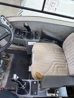 Kolový otočný bagr TEREX TW 110 - 8